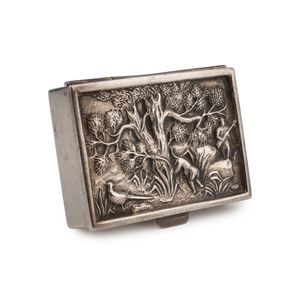 A sterling silver snuff box with repousse decorated top,…