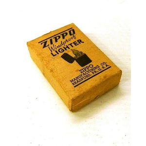 A vintage Zippo lighter, new in box together with brass cow…