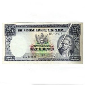 A rare New Zealand £5 Fleming bank note with printing flaw, the…