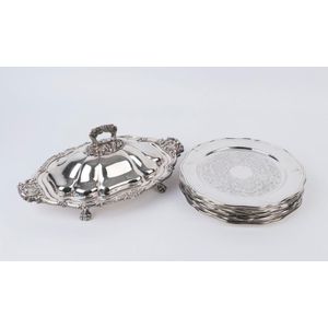 A large silver plated rococo style lidded entree dish with 10…