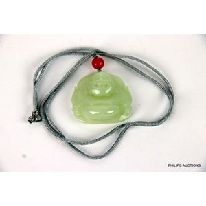 A jade Buddha pendant, a pale green stone relief carved as the…