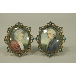 A pair of early 20th century miniature on ivory portraits of…