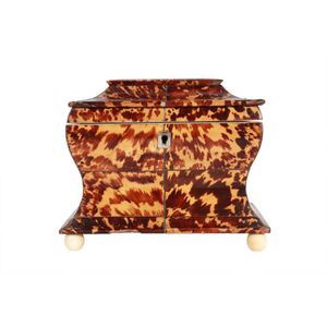 Early 19th century tortoiseshell caddy, with twin compartments…