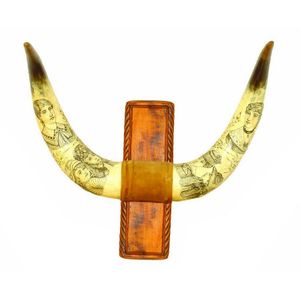 A pair of scrimshaw bullock horns, decoratively worked with…