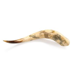 A scrimshaw powder horn decorated with birds, animals and…