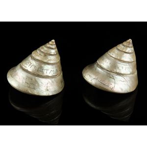 A pair of scrimshaw sailors love tokens, the shells engraved…