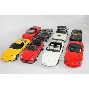 Four Danbury Mint open top sports vehicles, including '1963…