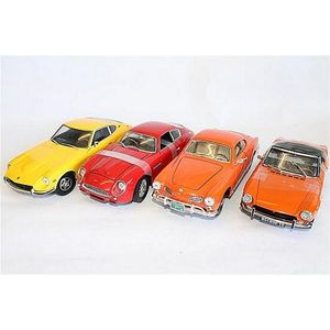 Four various model cars, including Aston Martin, Volkswagon,…