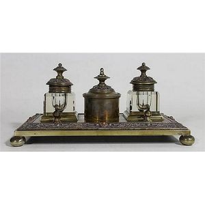 A nineteenth century bronze desk standish, with two ink wells…