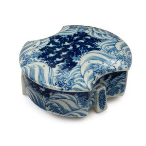 A Japanese Arita ware blue and white porcelain box with wave…