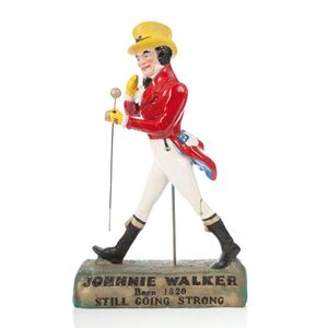 A Johnnie Walker polychrome cast advertising figure. Height 73…