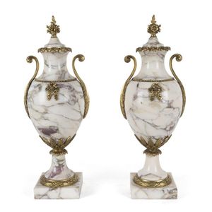 A pair of French mantel urns, marble with ormolu mounts, mid…