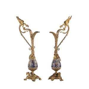 A pair of French ornamental ewers, champleve enamel and gilded…