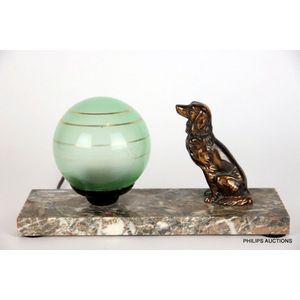 An Art Deco spelter Retriever desk lamp, circa 1930, in copper…