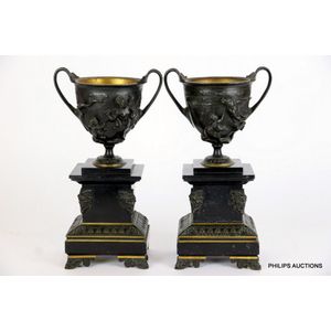 A pair of Grand Tour bronze and black marble urns, 19th century,…