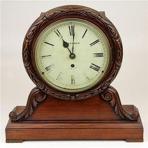 Angelo Tornaghi carved timber mantle clock with fusee movement,…