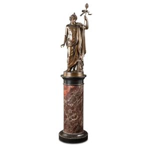 A bronze statue of a Roman classical figure holding a sceptre…