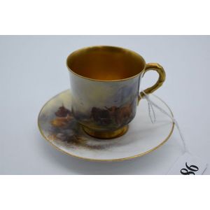 A Royal Worcester porcelain cup and saucer decorated with hand…