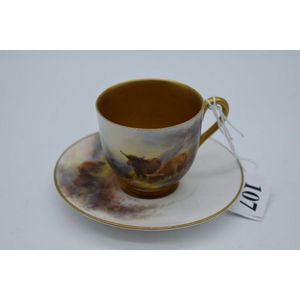 A Royal Worcester porcelain cup and saucer decorated with hand…