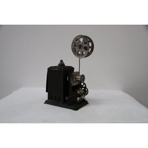 An Australian movie projector, 34 cm high, 20 cm wide.