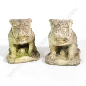 A pair of Church Stone bulldog garden/house ornaments, the…