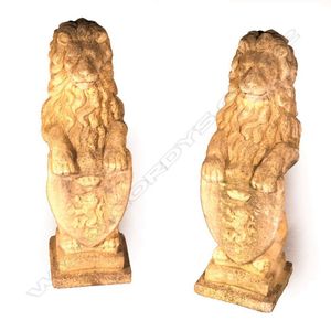 A pair of classical Church Stone heraldic standing lions, each…