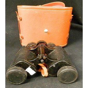 A pair of Super Zenith 8 x 30 binoculars with leather case