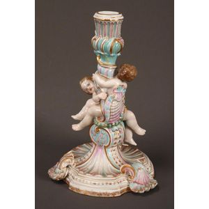 Late 19th century German porcelain candlestick, decorated with…