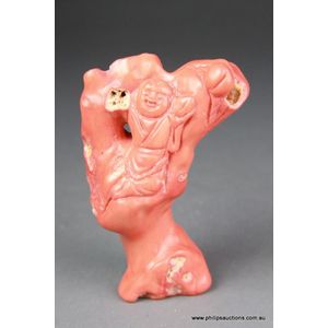 A Chinese carved coral ornament, in orange and utilising the&hellip;