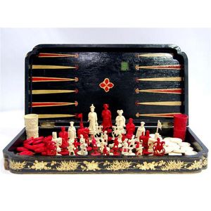 A Chinese ivory games set and lacquer board, in original black…