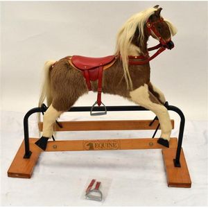 A cow Hide covered rocking horse with horse hair Mane & tail…