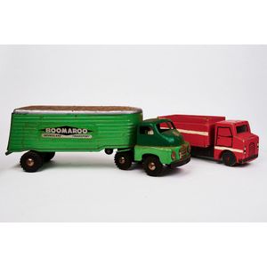 Two toy Trucks, one pink, the other green metal with decal…