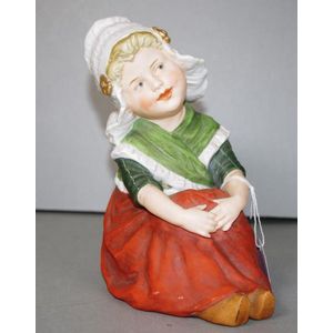 Heubach Koppelsdorf bisque figure of a seated Dutch girl,…