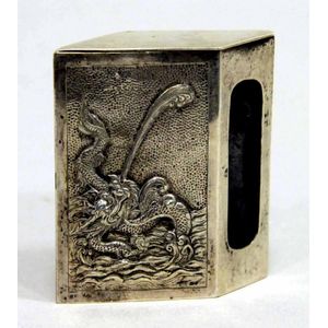 A Chinese silver match box holder with relief sea dragon…