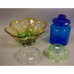 Two vintage glass jelly moulds together with a blue lidded…