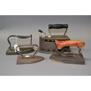 Two antique French flat irons and an antique coal iron and a…
