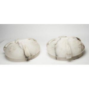 A pair of alabaster hanging light shades with carved floral…