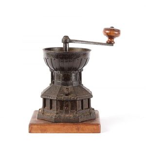 An old Victorian cast iron coffee grinder, circa 1850, the…