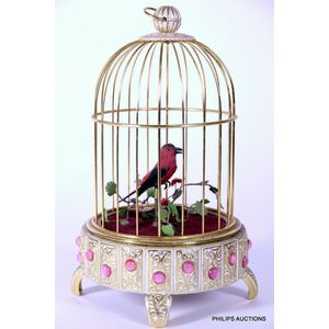 A Songbird in a gilded cage automaton, post 1950, with…