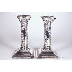 A pair of Sheffield plate column candlesticks, 19th century,…