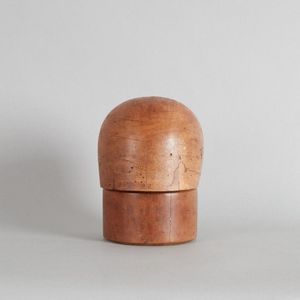 A Victorian hat block, made from wood. The head form slots onto…