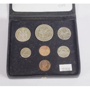 Cased Royal Canadian Mint 1971 coin issue containing $1 coin, 4…