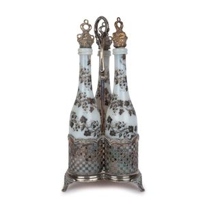 An antique silver plated three bottle decanter stand with set…