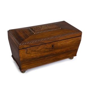 An antique English tea caddy, rosewood veneer with inlaid brass…
