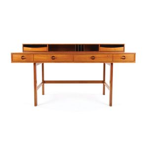 A Peter Lovig Neilsen teak fliptop desk by Dansk. Height 71 cm.…