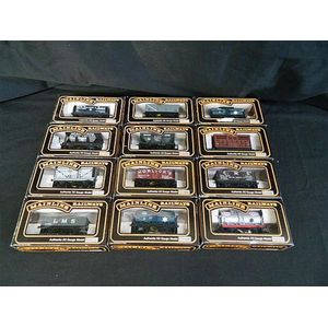 A collection of twelve various Mainline Model Railways wagons