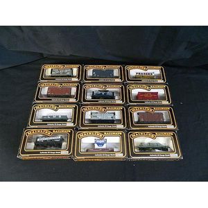 A collection of twelve various Mainline Model Railways wagons