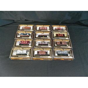 A collection of twelve various Mainline Model Railways wagons
