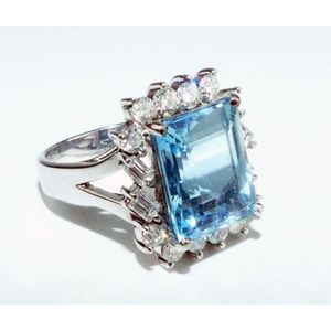 Bright aquamarine and diamond ring showing a transparent deep…