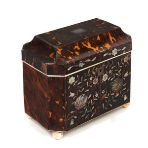 A George IV mother-of-pearl inlaid tortoiseshell tea caddy,…
